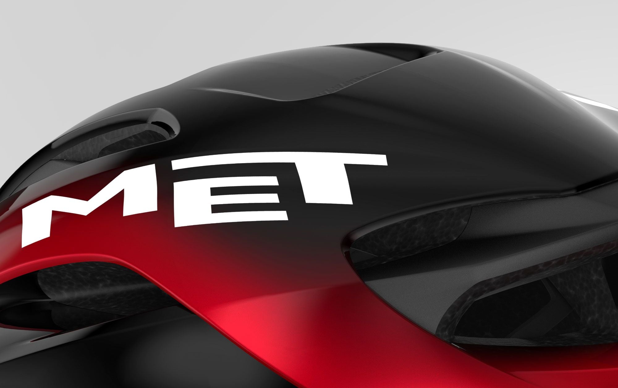 A close up of the Met logo on the black and red Met Rivale II MIPS Road Helmet