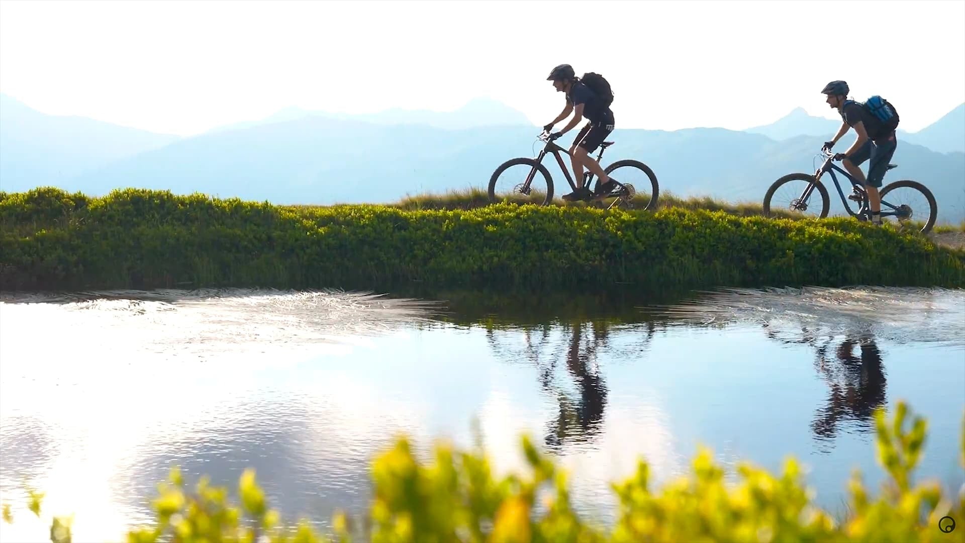 A picture of two people riding on mountain bikes with Ergon saddles