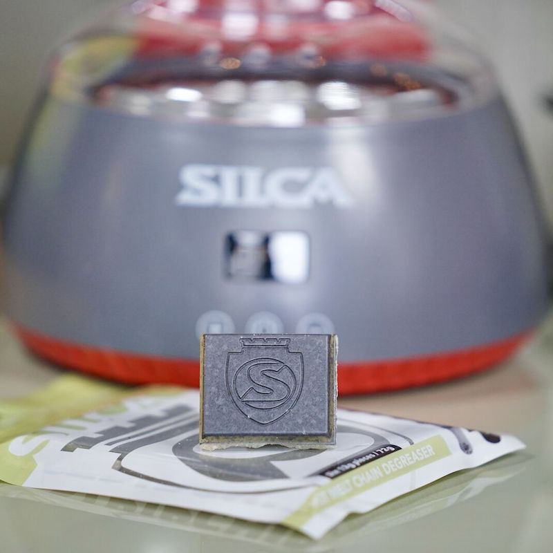 A picture of the Silca Strip Chip in front of a Hot Wax Machine